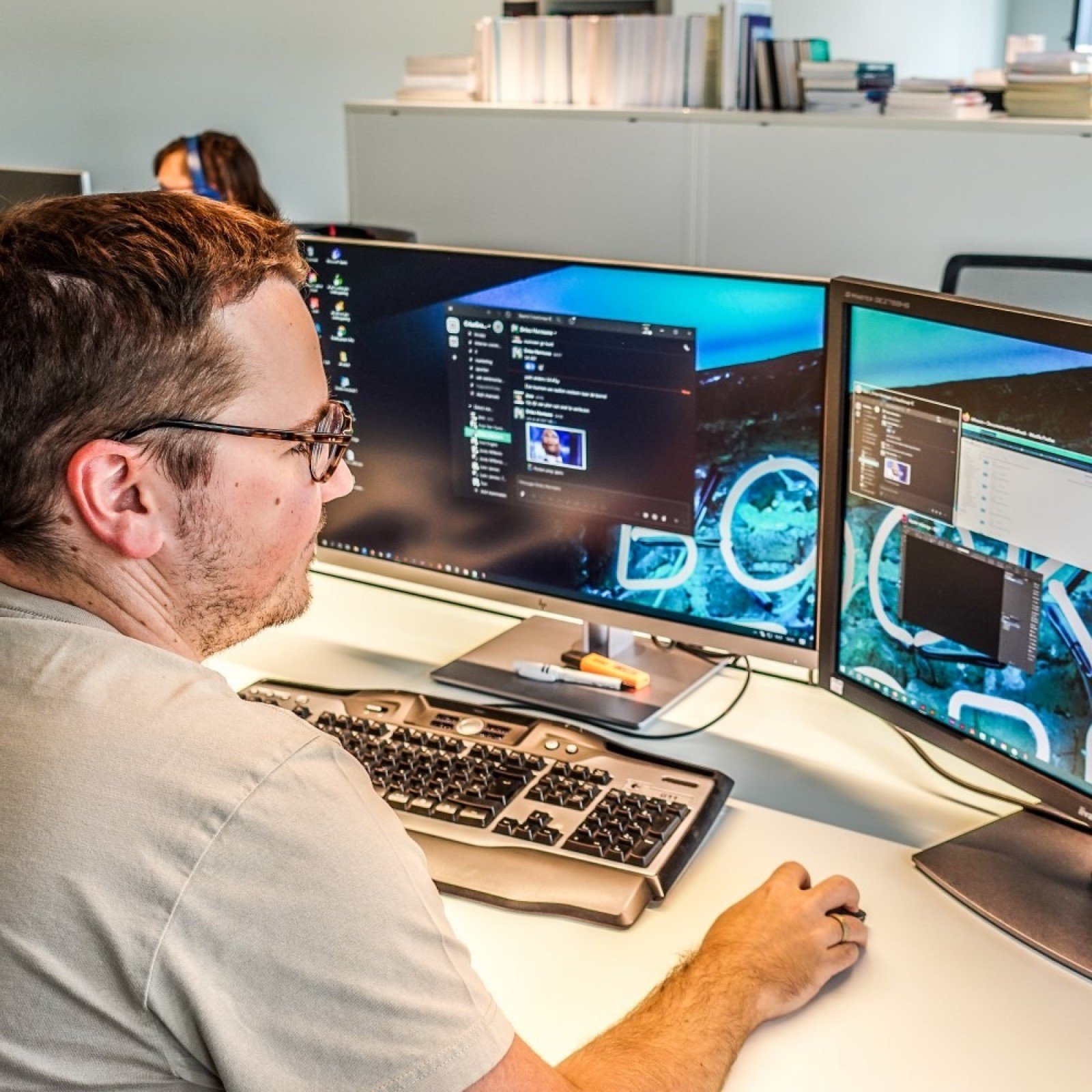 Crius employee setting at a desk