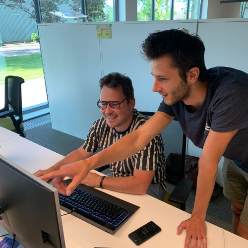 Crius employee pointing at screen